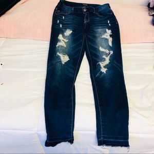 Skinny ripped jeans with frayed bottoms